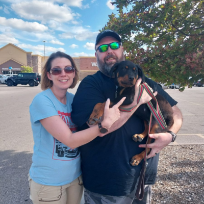 Happy family taking home their Ohio Rottweilers puppy