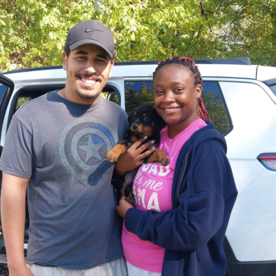 Happy family taking home their Ohio Rottweilers puppy