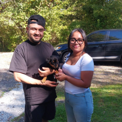 Happy family taking home their Ohio Rottweilers puppy