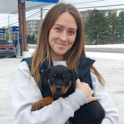 Happy family taking home their Ohio Rottweilers puppy