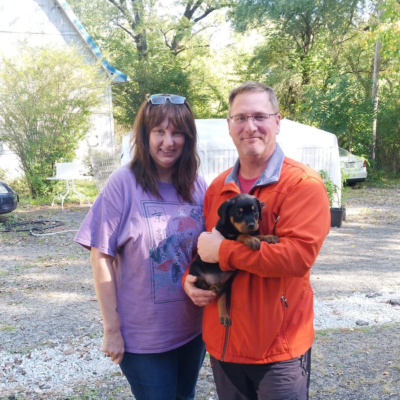 Happy family taking home their Ohio Rottweilers puppy