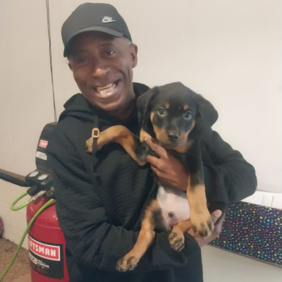 Happy family taking home their Ohio Rottweilers puppy